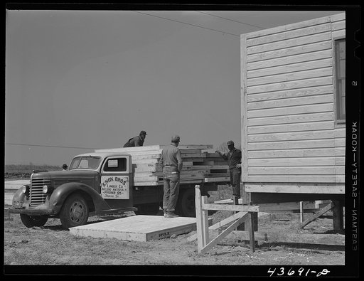 Truckload of sections for one of the prefabricated houses being built at Pacolet, South Carolina for farmers moved out of the Camp Croft area