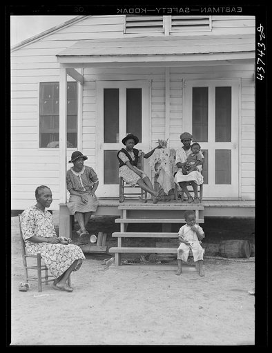 Untitled photo, related to: Negro family and friends at one of the prefabricated houses for Negroes at Hazlehurst Farms Inc., Hazlehurst, Georgia