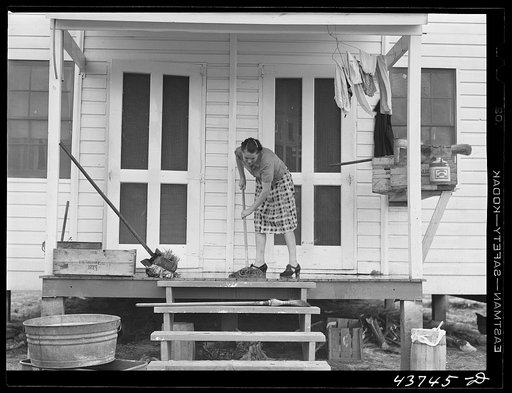 Mrs. James Butler, housecleaning at their new home at Hazlehurst Farms Inc., Hazlehurst, Georgia