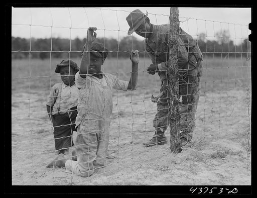 Untitled photo, related to: Putting up a fence at the community garden for the Negroes at Hazlehurst Farms Inc.