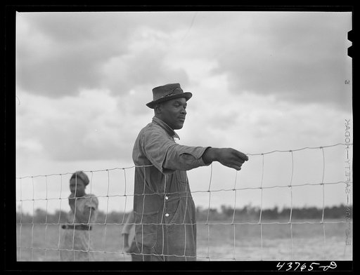 Untitled photo, possibly related to: Two of the Negro people who have been moved out of the Camp Stewart area near Hinesville to Hazlehurst Farms. Hazlehurst, Georgia