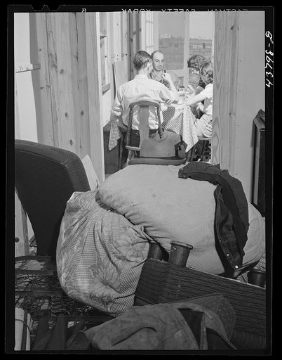 Lunchtime at the new prefabricated home of a family that is just moving in from the Camp Croft area. Pacolet, South Carolina
