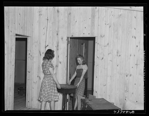 Untitled photo, possibly related to: Arranging furniture at the new prefabricated house of the Lee family. Near Pacolet, South Carolina