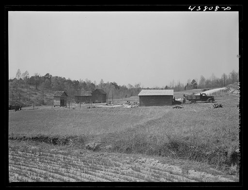 This road is the Camp Croft boundary. The family who lived in the house at the left is moving into the barn on the right
