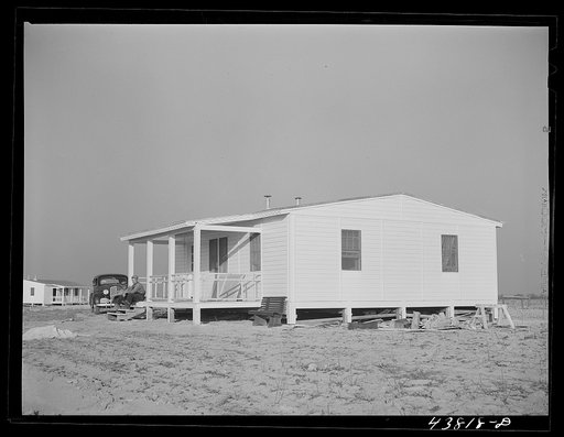 One of the completed and painted prefabricated houses for farmers moved out of the Camp Croft area at Pacolet, South Carolina