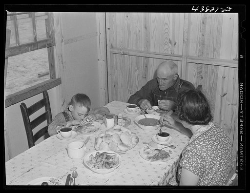 Family having lunch at their new prefabricated house at Pacolet, South Carolina