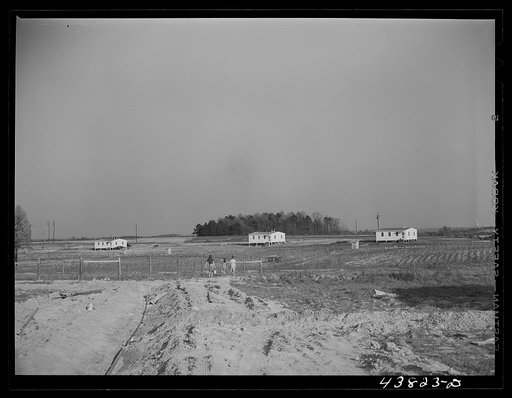 Untitled photo, possibly related to: While water pipes are being laid families had to get their water at one of the wells nearby. When water system is completed there will be a pump at every house. Pacolet, South Carolina. At the FSA (Farm Security Administration) prefabricated houses