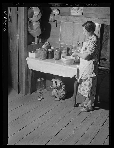 Mrs. L. Smith still has some canned goods left over from the winter. Carroll County, Georgia (see general caption)