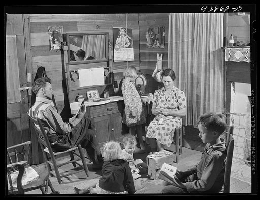 Mr. and Mrs. L. Smith and their younger children in their home on their farm, Carroll County, Ga.