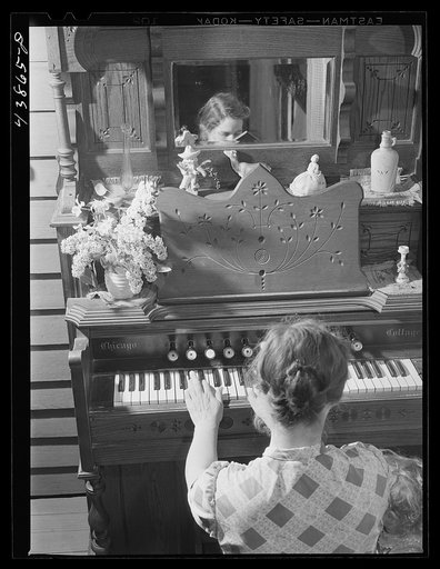 In the evening Mrs. L. Smith plays a few hymns at the organ. Carroll County, Georgia (see general caption)