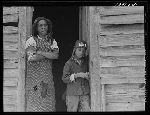 This Negro woman lives with her husband and two grandchildren in an old converted schoolhouse. All the rest of her children have left the county. Heard County, Georgia