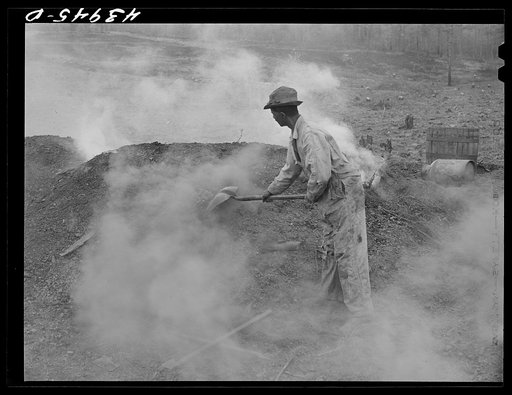 Henry Dukes, Negro FSA (Farm Security Administration) borrower, burning charcoal. Southwestern part of Heard County, Georgia