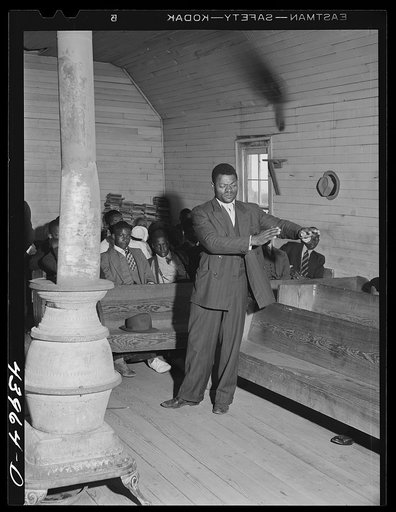 Singing "Trying To Make a Hundred, Ninety Nine and a Half Won't Do" during the collection at a Negro church service in Heard County, Georgia.