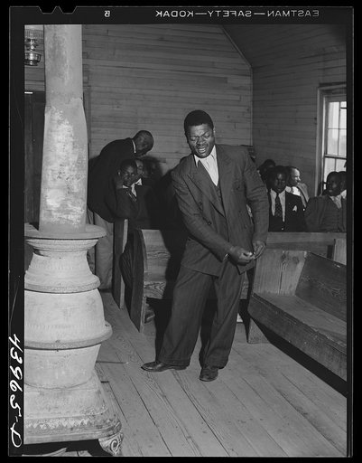 Singing "Trying To Make a Hundred, Ninety Nine and a Half Won't Do" during the collection at a Negro church service in Heard County, Georgia.