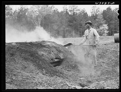 Untitled photo, possibly related to: Henry Dukes, Negro FSA (Farm Security Administration) borrower, burning charcoal. Southwestern part of Heard County, Georgia