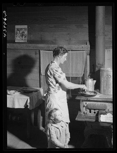 Mrs. Lemuel Smith preparing the afternoon meal on her farm in Carroll County, Georgia (see general caption)