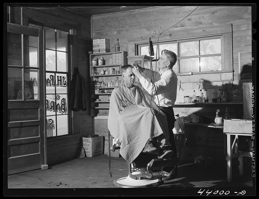 Mr. J. H. Parham, barber and notary public, in his shop in Centralhatchee, Heard County, Georgia