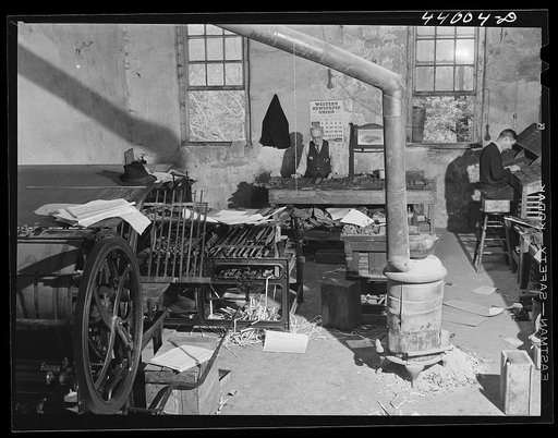 Untitled photo, possibly related to: Mr. McKutchins, editor of the News and Banner, Heard County newspaper, in his office in Franklin, Georgia
