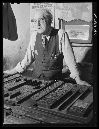Untitled photo, possibly related to: Mr. McKutchins, editor of the News and Banner, Heard County newspaper, in his office in Franklin, Georgia