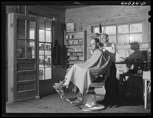 Untitled photo, possibly related to: Mr. J. H. Parham, barber and notary public, in his shop in Centralhatchee, Heard County, Georgia