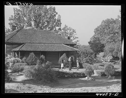 Three of the children of Lemuel Smith, FSA (Farm Security Administration) borrower, waiting outside their house for the school bus. Carroll County, Georgia