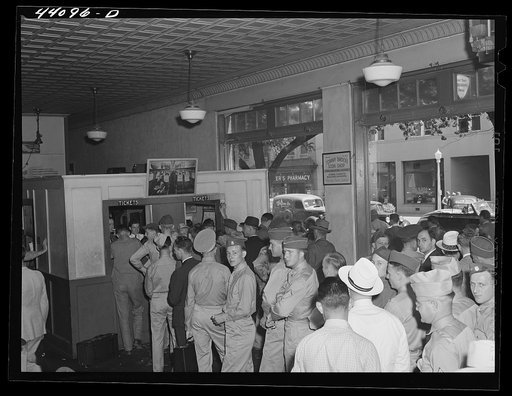 Untitled photo, possibly related to: The crowded bus terminal in Columbus, Georgia. Soldiers flock the station going away for weekends
