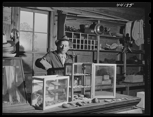 Mr. Bickers runs a country store and has an interesting collection of Indian relics found in the area. Near White Plains, Greene County, Georgia
