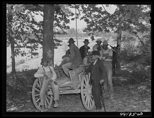 Waiting for FSA (Farm Security Administration) meeting of Negro borrowers to begin. Near Woodville, Greene County, Georgia