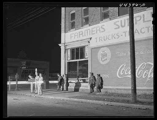 Untitled photo, possibly related to: Soldiers from a nearby Army camp waiting for a bus in Anniston, Alabama