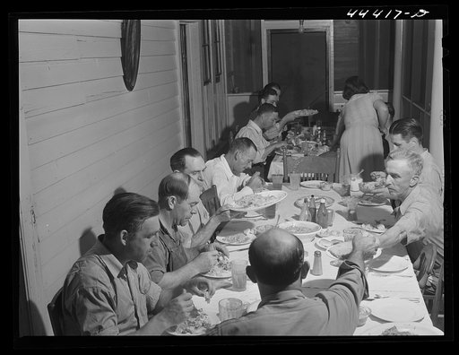 Workers from the nearby powder plant having dinner at their boarding house in Childersburg, Alabama