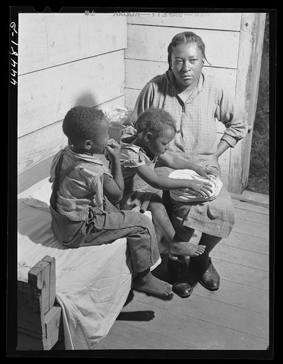 Untitled photo, possibly related to: Eating "white dirt," a white clay found in several parts of the county, which some people eat. Greene County, Georgia