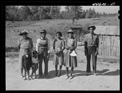 Family who has just come back from a funeral. Greene County, Georgia