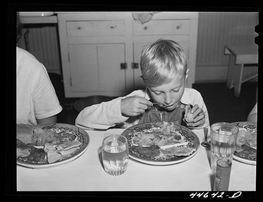 Untitled photo, possibly related to: Eating a five-cent hot lunch at the Woodville public school. Greene County, Georgia