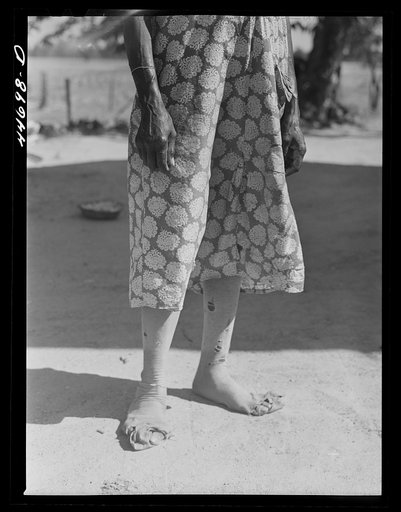 Untitled photo, possibly related to: Feet of a Negro farm woman, who together with two children runs a rented farm. Near Woodville, Greene County Georgia