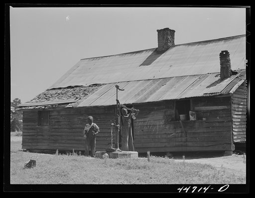 Children of Mr. Frank Cahnipian at their FSA (Farm Security Administration) pump. White Plains, Greene County, Georgia