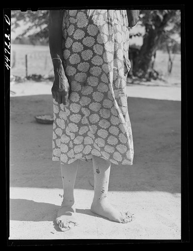 Untitled photo, possibly related to: Feet of a Negro farm woman, who together with two children runs a rented farm. Near Woodville, Greene County Georgia