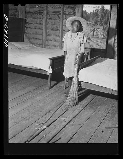 Daughter of Mr. Frank Champian, FSA (Farm Security Administration) borrower, sweeping up. Near White Plains, Greene County, Georgia