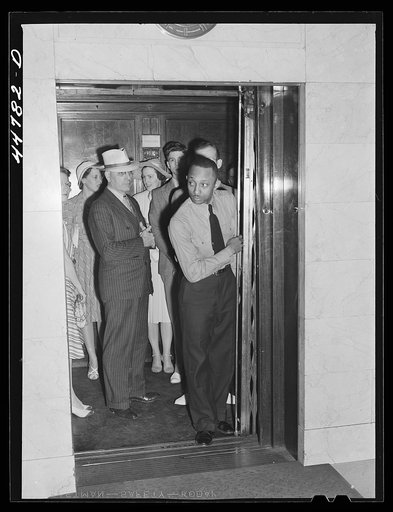 Elevator operator in the Barr Building. Washington, D.C.