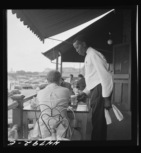 Negro waiter in Hertzog's seafood restaurant along the waterfront. Washington, D.C.