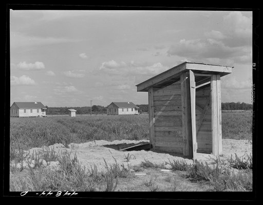 Group of prefabricated houses and privies that have been built by the FSA (Farm Security Administration) to take care of some of the white farmers who had to move out of the area taken over by the Army for maneuver grounds. Milford, Caroline County, Virginia