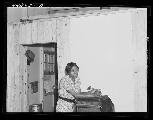 This young woman and her family moved from the area taken over by the Army to a prefabricated house built by FSA (Farm Security Administration) to take care of some of the farmers who had to move. Milford, Caroline County, Virginia
