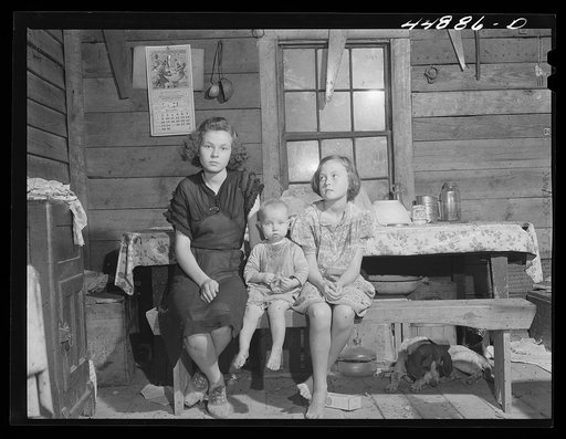 Some of the children of a family that is getting ready to move out of the area taken over by the Army in Caroline County, Virginia