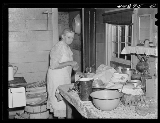This woman is packing her belongings and getting ready to move out of the area taken over by the Army in Caroline County, Virginia