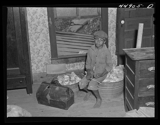 Waiting for the truck to come and move their belongings out of the area taken over by the Army in Caroline County, Virginia