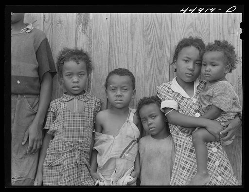 Some of the children of a family of ten who must move out of the area being taken over by the Army in Caroline County, Virginia