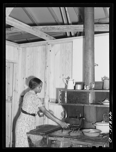 This young woman and her family moved from the area taken over by the Army to a prefabricated house built by FSA (Farm Security Administration) to take care of some of the farmers who had to move. Milford, Caroline County, Virginia
