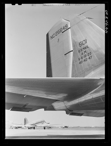 Two airliners on the landing field. In the background can be seen the Washington Monument. Municipal airport, Washington, D.C.
