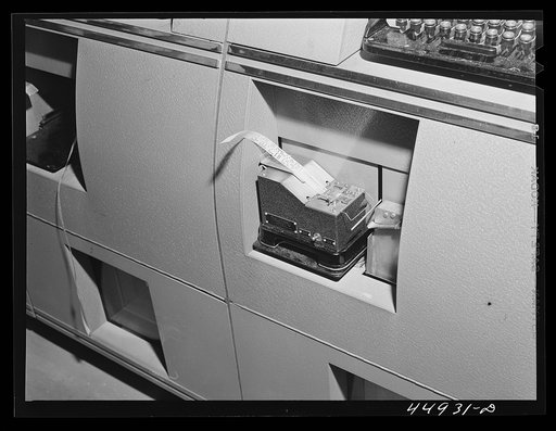 One of the tickers in the teletype room. Municipal airport, Washington, D.C.
