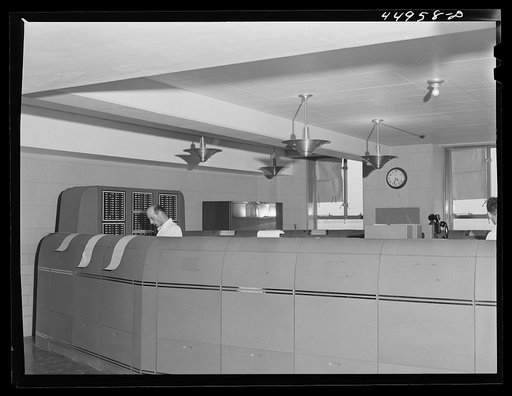 In the teletype room where weather data and other information is constantly being received. Washington D.C. municipal airport