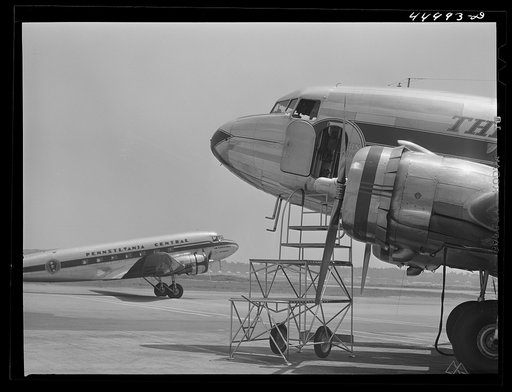 Untitled photo, possibly related to: An airliner taking on baggage and fuel. Washington, D.C. municipal airport